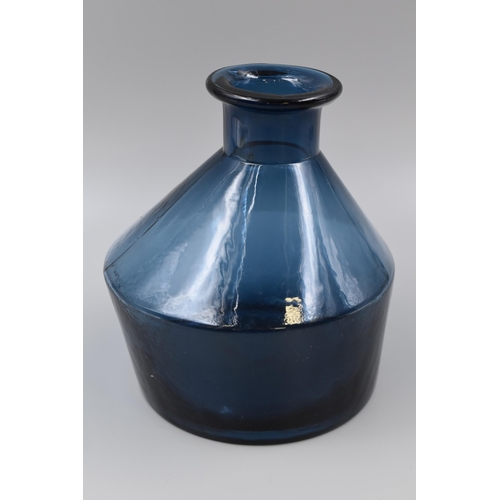 318 - Two items to include Unusual Eden Project Blue Vase (7”) and a Small Paraffin Lamp