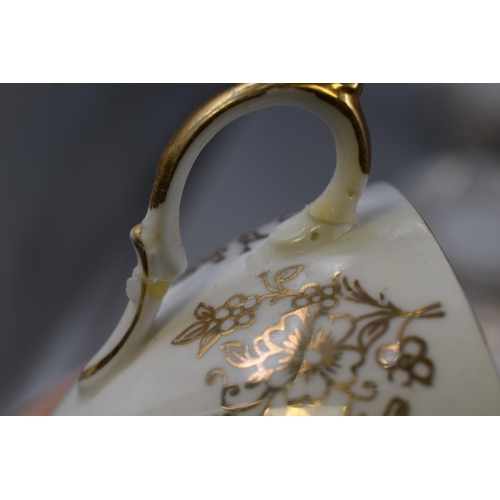 237 - A Nineteen Piece Gainsborough Gold and White Floral Tea Set, Some Pieces AF