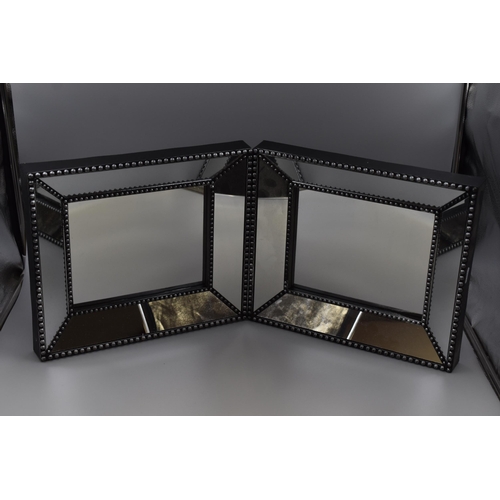 628 - Two deep frame black and silver mirrors measuring 15