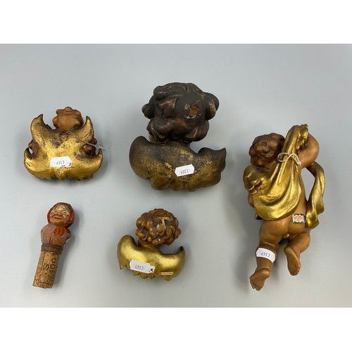 193 - Four Anri of Italy Hand Carved Wooden Cherubs and a traditional Hand Carved Wine Cork