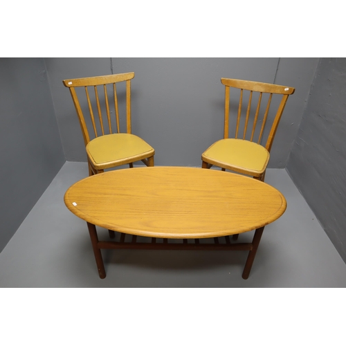 558 - Pair of Mid Century Faux Leather topped Dinning Chairs and a Oval Coffee Table with undershelf Stora... 