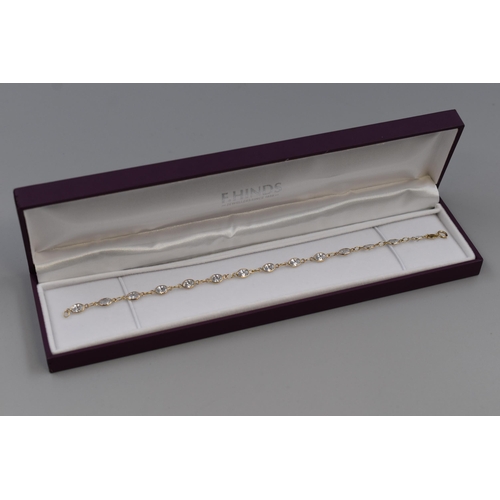 7 - Hallmarked Gold 375 (9ct) Clear Stoned Bracelet. Complete in Presentation Box (3.53 grams)