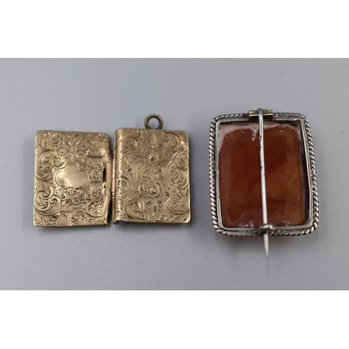 23 - Two Vintage Silver Pieces of Silver jewellery to include a Cabochon Brooch and a Photo Holder pendan... 