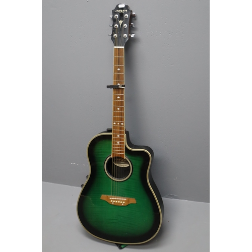 605 - An Aria AMB-35 Green Burst Electro-Acoustic Guitar, With Capo