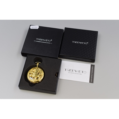 137 - Treeveto pocket watch with fob, features opening front with dragon motif and transparent rear case d... 