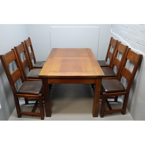 642 - Dark hardwood extending dining table with six chairs, measures 60