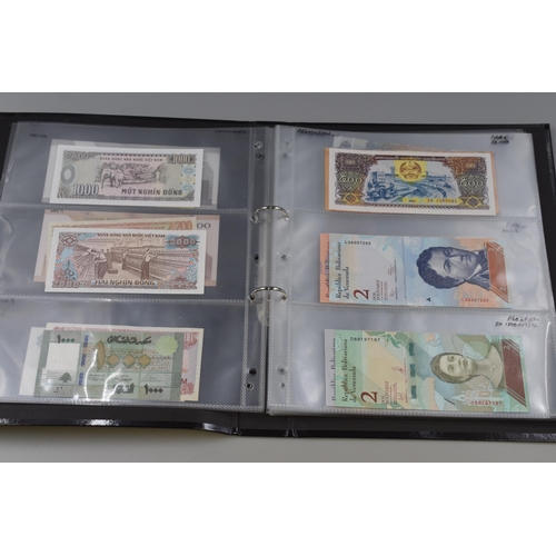 194 - Folding Containing a Large Selection of Uncirculated Banknotes. Includes North Korea, Nigeria, Mongo... 