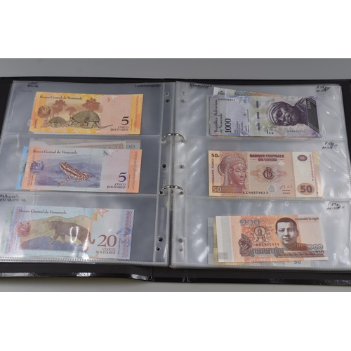 194 - Folding Containing a Large Selection of Uncirculated Banknotes. Includes North Korea, Nigeria, Mongo... 