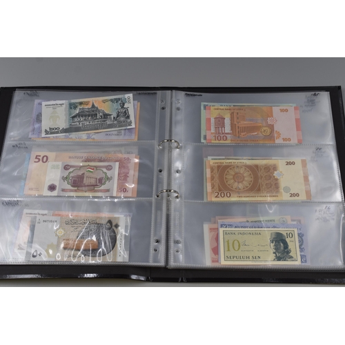 194 - Folding Containing a Large Selection of Uncirculated Banknotes. Includes North Korea, Nigeria, Mongo... 