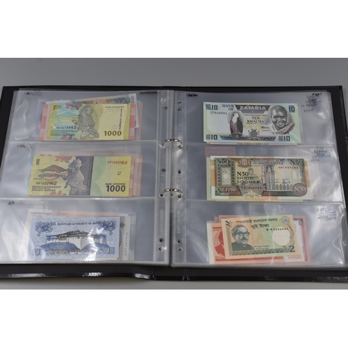 194 - Folding Containing a Large Selection of Uncirculated Banknotes. Includes North Korea, Nigeria, Mongo... 