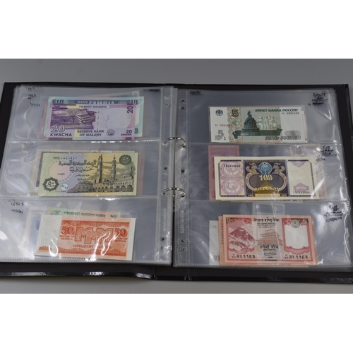 194 - Folding Containing a Large Selection of Uncirculated Banknotes. Includes North Korea, Nigeria, Mongo... 