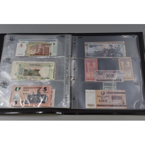 194 - Folding Containing a Large Selection of Uncirculated Banknotes. Includes North Korea, Nigeria, Mongo... 