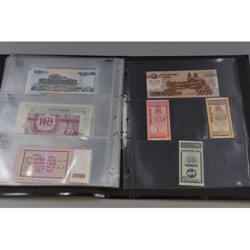 194 - Folding Containing a Large Selection of Uncirculated Banknotes. Includes North Korea, Nigeria, Mongo... 