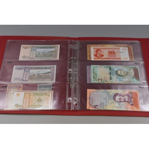 199 - Folder Containing a Large Selection of Uncirculated Worldwide Bank Notes. Includes Vietnam, Mongolia... 