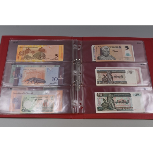 199 - Folder Containing a Large Selection of Uncirculated Worldwide Bank Notes. Includes Vietnam, Mongolia... 