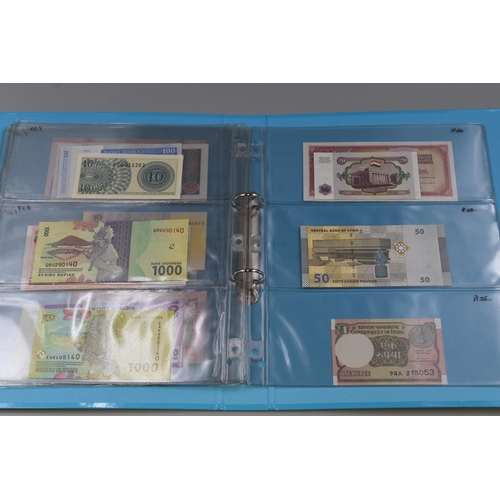 200 - Folder Containing a Large Selection of Uncirculated Worldwide Bank Notes. Includes Zambia, Lebanon, ... 