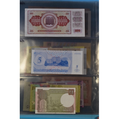 200 - Folder Containing a Large Selection of Uncirculated Worldwide Bank Notes. Includes Zambia, Lebanon, ... 