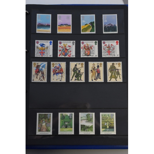 513 - Three items to include Two Stamp Albums with a Selection of Mint and Postmarked Stamps, Together wit... 