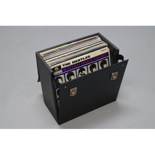 597 - A Record Case With a Selection of Vinyl LP's. Includes The Beatles, Rolling Stones, Adam and The Ant... 