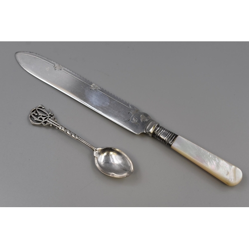 15 - Silver (unmarked) GOC Insignia Tea Spoon and a Silver Banded Bread Knife with Mother of Pearl Handle