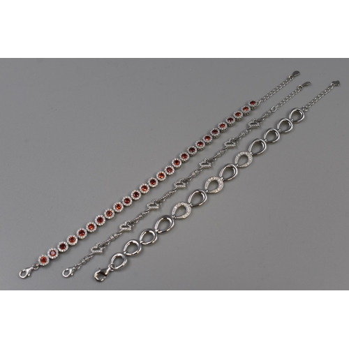 27 - Three Silver 925 Bracelets, includes Red Heart Design and Horseshoe Design. Complete with Presentati... 