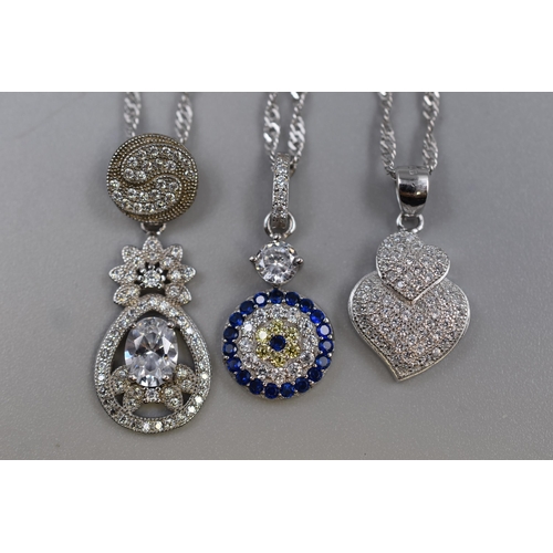 60 - Three Silver 925 Necklaces to include Blue Stoned Design, Heart Design and Large Diamanté Cle... 