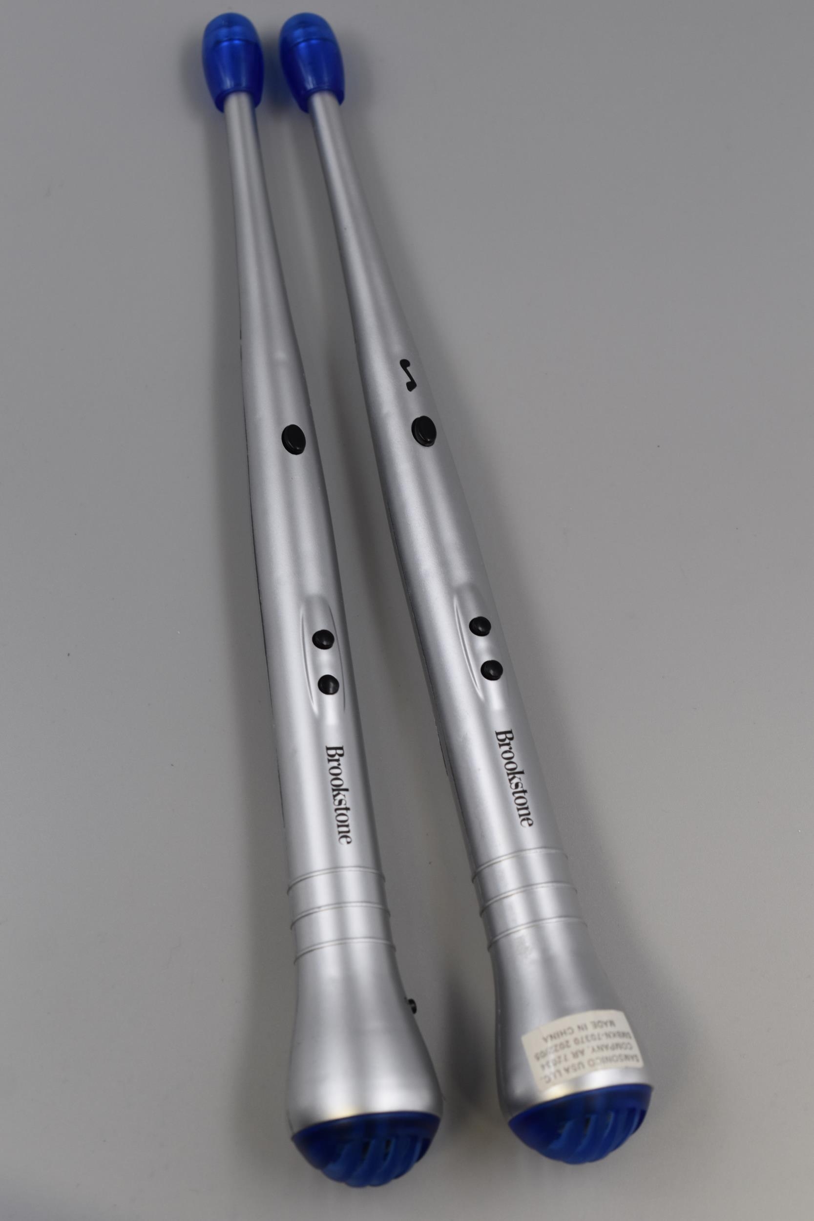 A Set of Two Brookstone Electronic Drumsticks Working When Tested