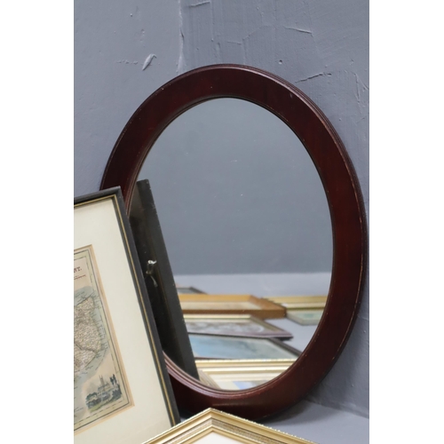 370 - A Selection of Eleven Framed Artpieces, And A Wooden Framed Oval Mirror. Includes Two Helen Bradley ... 