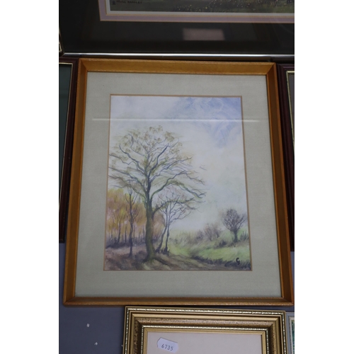 370 - A Selection of Eleven Framed Artpieces, And A Wooden Framed Oval Mirror. Includes Two Helen Bradley ... 