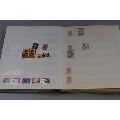 375 - Two Stamp Albums Containing A Large Selection of South African Stamps