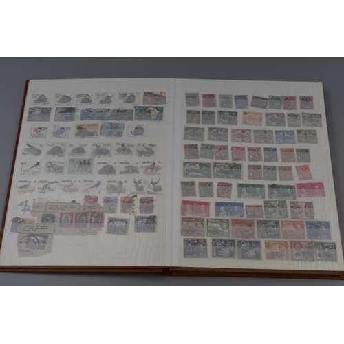 376 - Three Stamp Albums Containing A Large Quantity of Commonwealth Stamps