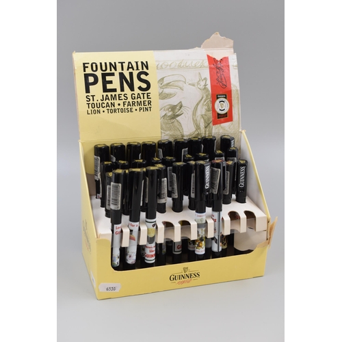 412 - Thirty Two Guinness Fountain Pens complete with Display Case