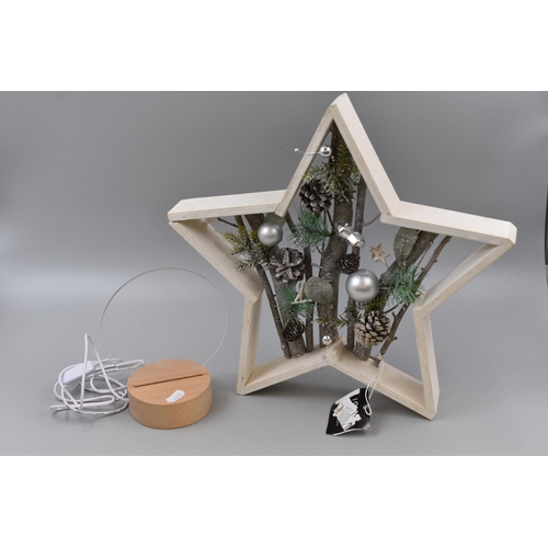 677 - Two items to include Large John Lewis Decorative Wooden Christmas Star Ornament and a Light Up Chris... 