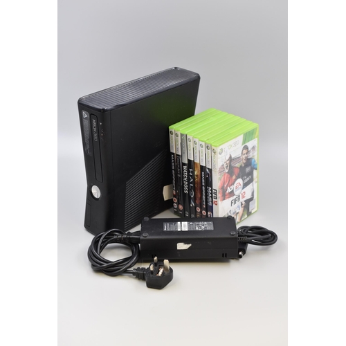 495 - Xbox 360 (powers on) with a Selection of Games