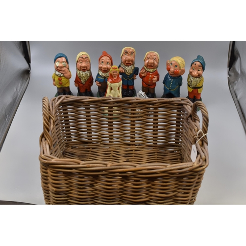 693 - Collection of Snow White and The Seven Dwarfs Plus a Frog Cement Garden ornaments in a Wicker Basket