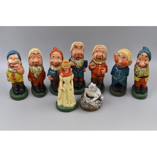 693 - Collection of Snow White and The Seven Dwarfs Plus a Frog Cement Garden ornaments in a Wicker Basket