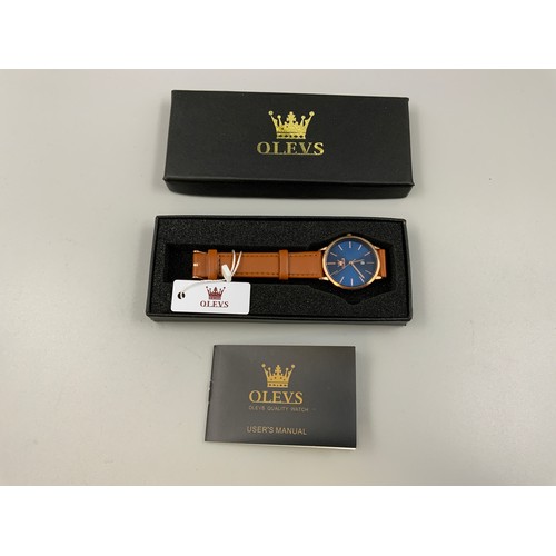 101A - OLEVS New Gents Watch with Leather Strap, Case and Booklet (Working)