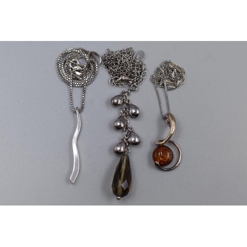 45 - Three 925. Silver Necklaces (Two Pendant Necklaces, One Necklace). Includes Amber Effect, And Two Ot... 