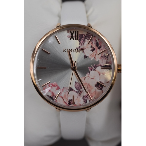 104 - Ladies Kimomt wristwatch in rose gold with floral design face and ivory strap. Brand new in presenta... 