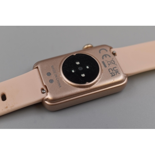 145 - Ladies multi-function smart watch in rose gold with pink strap. Boxed, includes charging lead, worki... 