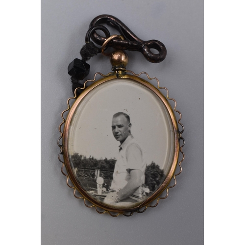 76 - Double Sided Photo Locket Pendant (Possibly gold)