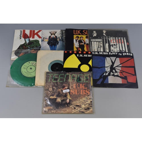 505 - Nine UK Subs 7” Vinyl Singles. Includes Party In Paris (GEMS 42) On Transparent Yellow Vinyl, ... 