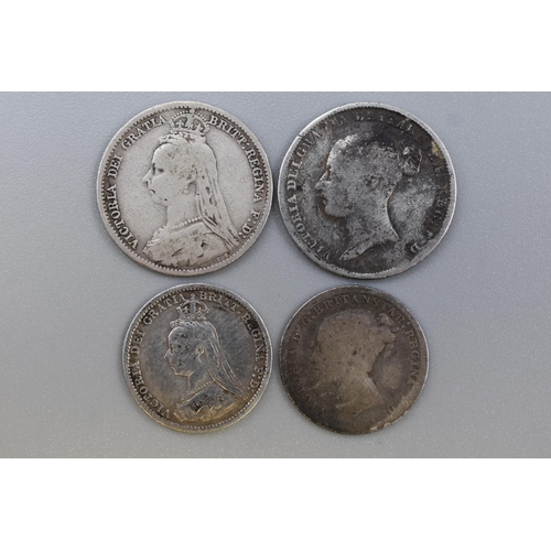 204 - Four UK Victorian Silver Coins. Includes 1850 Sixpence, 1892 Sixpence, 1873 Threepence, And 1887 Thr... 