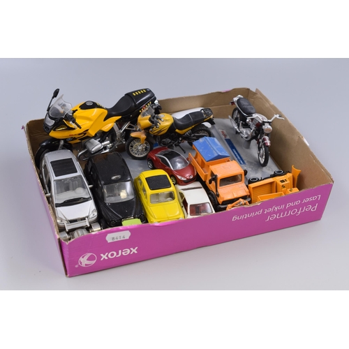 560 - Varied selection of model cars and motorbikes to include black cab, Triumph and BMW bikes, snow plou... 