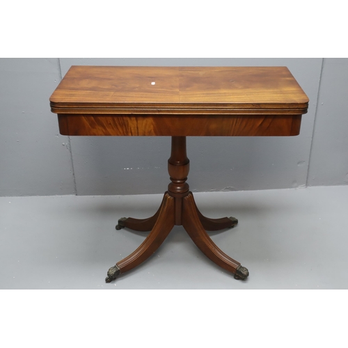 570 - A Folding Wooden Card Table With Baize Top, On Lions Claw Feet. Approx 33