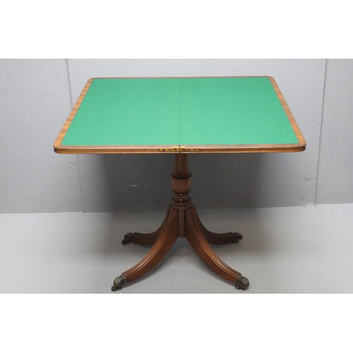 570 - A Folding Wooden Card Table With Baize Top, On Lions Claw Feet. Approx 33