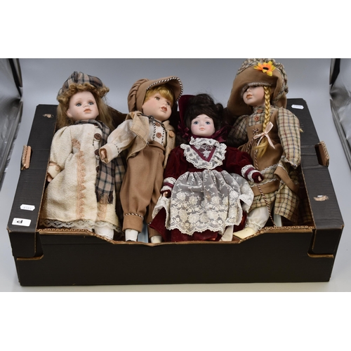 752 - Selection of four porcelaine dolls (3 with stands) each standing 16