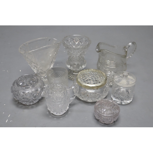 815 - A Selection of Clear Cut Glassware. Includes Jugs, Vases, Drinking Glasses, And More