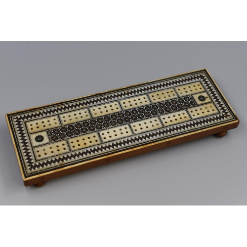 278 - An Ornate Victorian Parquetry and Mother of Pearl Cribbage Board