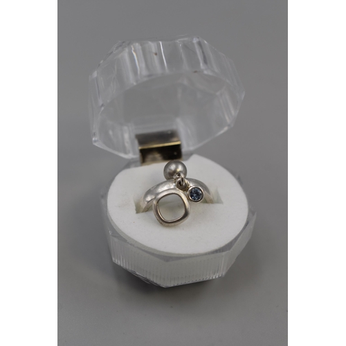 40 - A 925. Silver Fossil Blue Stoned Charm Ring, With Presentation Box